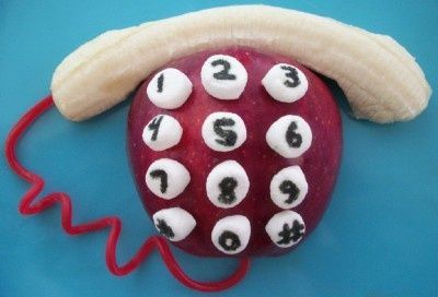 We made this phone fruit snack using 1 red apple, 1 banana, 5 mini marshmallows, 1 Twizzler string, and edible marker.